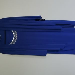 One peice long sleeve dress, it Looks like it has a jacket, but not deattached